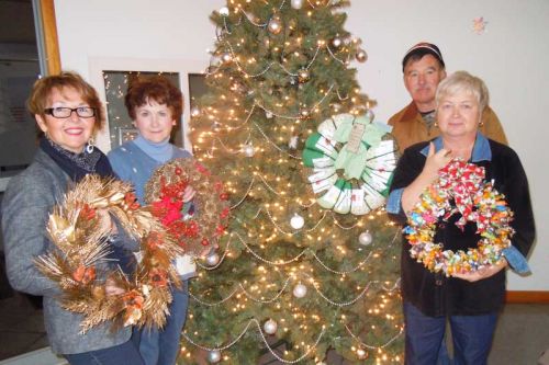 members of the VCA , l-r, Marilyn Orser, Judy Conway and Doug and Joyce Casement with a selection of the wreaths auctioned off at the VCA's annual Christmas in the Village event in Verona on November 28